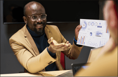 Man presenting a data report during a strategy meeting.